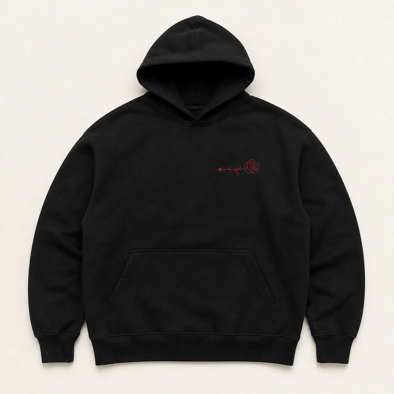 Black heavyweight hoodie laid flat with a small red embroidered rose and arrow on the left chest